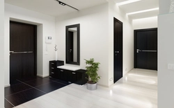 Bathroom design with dark door