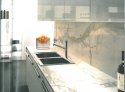 Marble Countertop And Splashback In A White Kitchen Photo