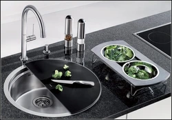 Sink and stove in the kitchen photo