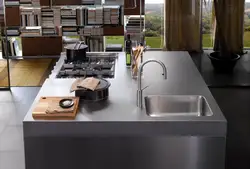 Sink and stove in the kitchen photo