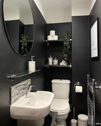 Black bathtub in the bathroom interior photo