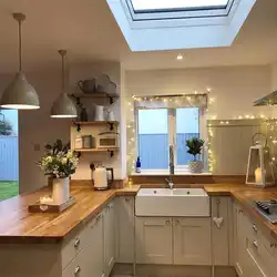 Kitchen interior with three windows