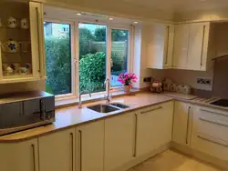 Kitchen interior in a house with window and door