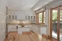 Kitchen interior in a house with window and door