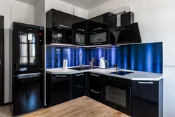 Photo of kitchen with black glass