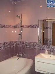 Photo Of A Bathtub After Renovation With Tiles In An Apartment