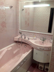 Photo Of A Bathtub After Renovation With Tiles In An Apartment