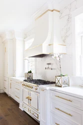 White kitchen with gold handles photo