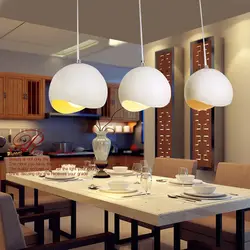 Lamps above the table in the kitchen photo