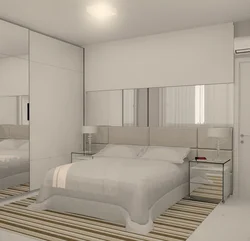 Built-in wardrobes in a bedroom with a bed photo design