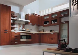 Cherry-colored kitchen in the interior photo