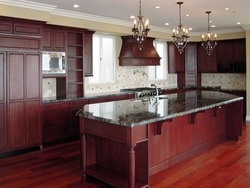 Cherry-colored kitchen in the interior photo