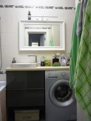 Black washing machine in the bathroom interior photo