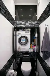 Black washing machine in the bathroom photo