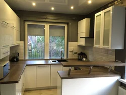 Small kitchen design with a window in the middle photo