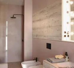 Bathtub with decorative plaster and tiles photo design