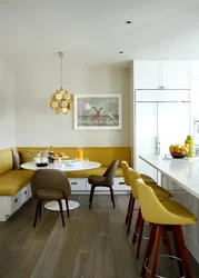 Yellow sofa in the kitchen interior