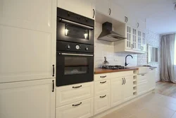 White kitchen black oven photo