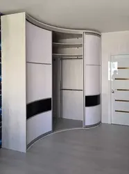 Large corner wardrobe in the bedroom photo