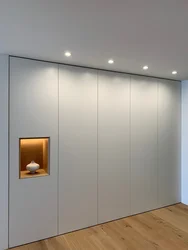Built-in wardrobes in the bedroom up to the ceiling photo