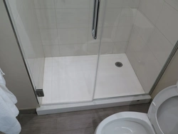 Photo of shower enclosures in the bathroom with a tray