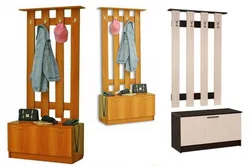 Narrow coat rack with shoe rack in the hallway photo