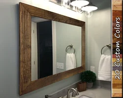 Mirror in a frame for the bathroom photo