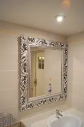 Mirror in a frame for the bathroom photo