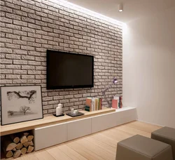 Интерьер гостиной с кирпичной белой стеной