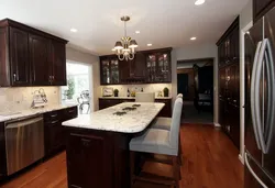 Light kitchen with dark furniture photo
