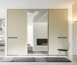Wardrobe doors with mirror in the hallway photo