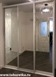 Wardrobe doors with mirror in the hallway photo