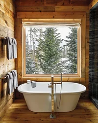 Window in the bathroom in a wooden house photo