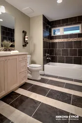 Bath design with dark and light tiles