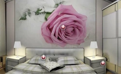 Photo of a bedroom with a flower above the bed