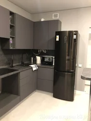 Graphite refrigerator in the kitchen interior