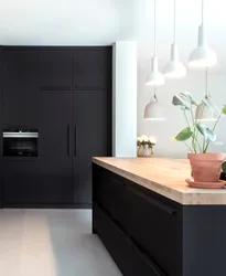 Graphite refrigerator in the kitchen interior