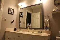 Mirrors in a small bathroom photo