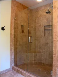 Do-it-yourself shower in an apartment made of tiles without a tray photo