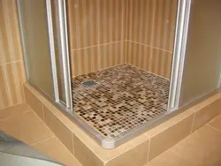 Do-it-yourself shower in an apartment made of tiles without a tray photo