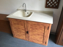 Overhead kitchen sink with cabinet photo