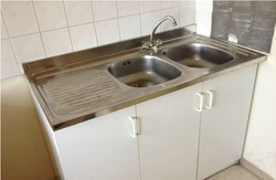 Overhead kitchen sink with cabinet photo