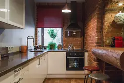 Brick kitchen in apartment photo