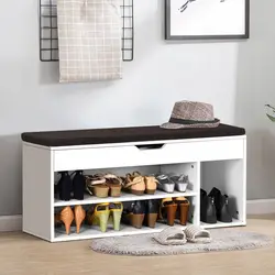 Shoe rack in the hallway with a seat and shelf photo