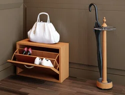 Shoe rack in the hallway with a seat and shelf photo