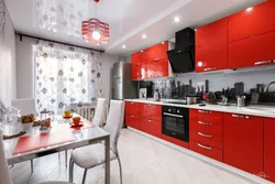 Photo of interiors of red kitchen apartments