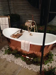 Cast iron bathtub in the countryside photo