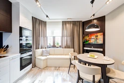 Kitchen design with sofa and TV photo