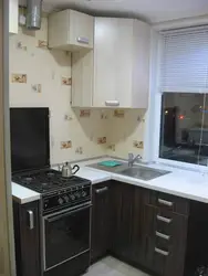 Small kitchen design with gas stove and refrigerator