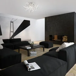 Интерьер гостиной с черно белым диваном